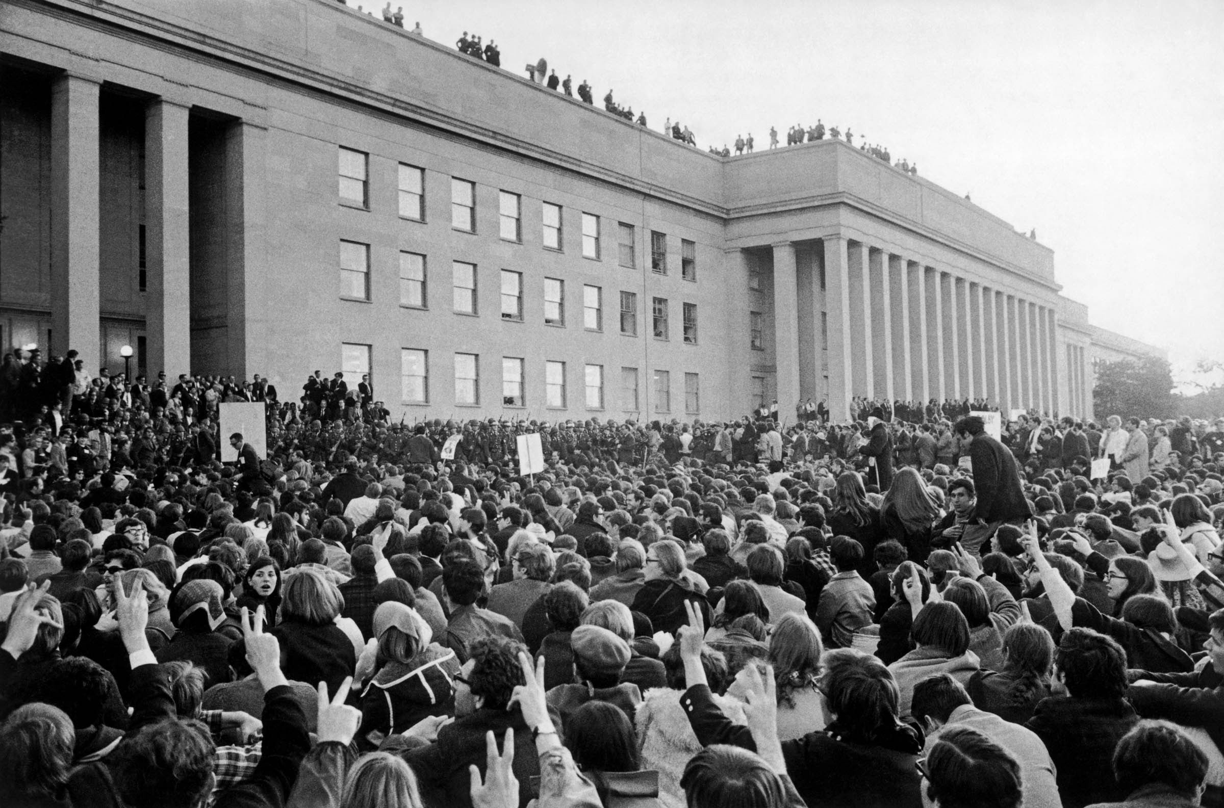 Confronted by a phalanx of soldiers, federal marshals, and police, antiwar demonstrators block the Pentagon on October 21, 1967.