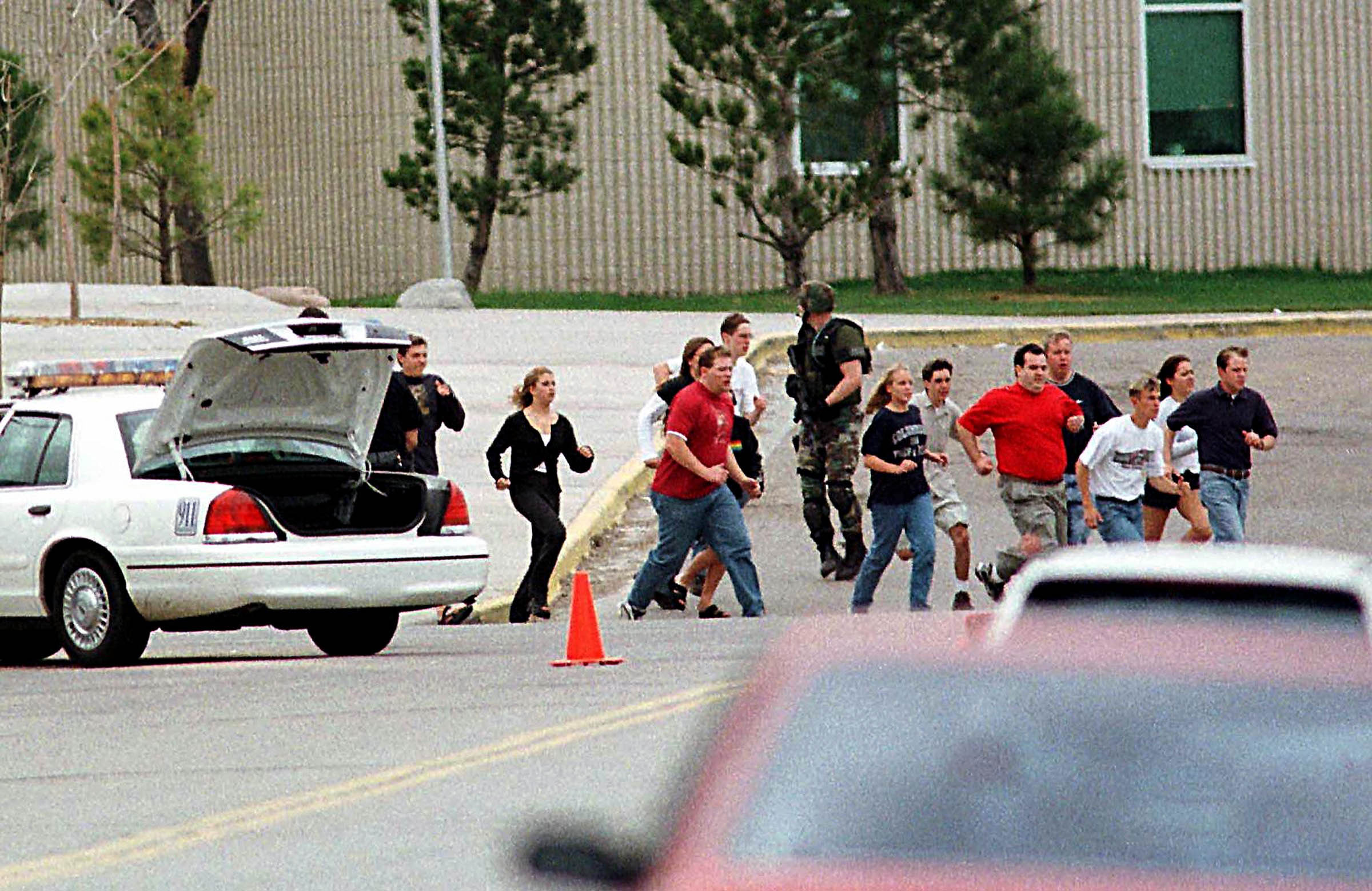 Students flee Columbine High School in Littleton, Colorado, after two teenagers armed with automatic weapons and explosives murdered twelve of their classmates and a teacher before committing suicide. The April 1999 incident highlighted the fearful toll of the estimated two hundred million guns in circulation in the United States, particularly their impact as a major “health problem” for young Americans. According to the Centers for Disease Control and Prevention, 4,643 children and teenagers were killed with guns in 1996 (including 1,309 suicides and 468 unintentional shootings). The <em>Journal of the American Medical Association </em>estimated that the cost of medical care for gun-related injuries amounted to &dollar;4 billion in 1995 alone. Since 1960, a million people have died from gunshots in the United States.