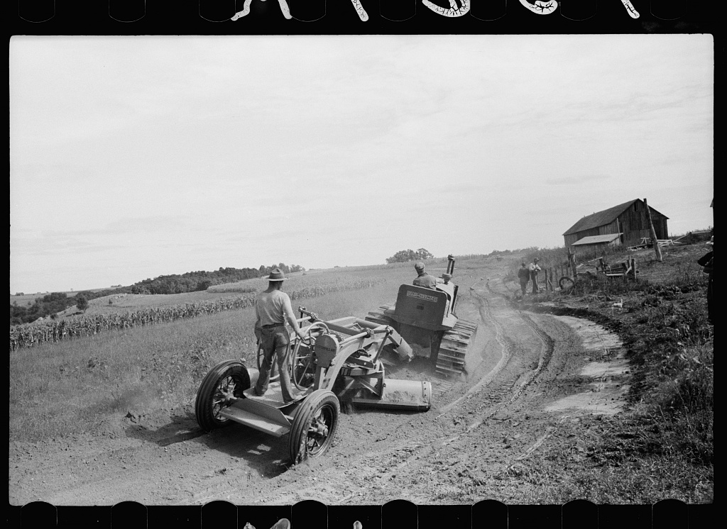 <em>The CCC altered landscapes to benefit Americans, for example, in Vernon County, Wisconsin CCC created soil conservation and erosion control projects. In the wake of the Dust Bowl, farmers called on the federal government to help stop erosion and protect crops. In this photo, CCC workers create a terrace to prevent water drainage from forming gullies.</em>